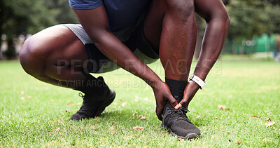 Buy stock photo Outdoor, man and ankle pain with hands, fitness and grass field for exercise and workout with muscle tension. Person, athlete and runner with accident, overworked joint and burnout from training
