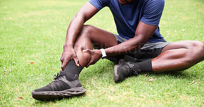 Buy stock photo Park, man and leg pain with hands, fitness and grass field for exercise and workout with muscle tension. Person, athlete and runner with outdoor accident, overworked joint and burnout from training