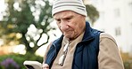 Phone, typing and senior man outdoor with texting, chatting or online advice on pension. Reading, technology and elderly person on cellphone for retirement planning on mobile app in park on weekend.