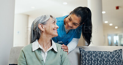 Buy stock photo Support, nurse and shoulder touch with old woman for assisted living, healthcare and happiness. Caregiver, smile and comfort with person on sofa for homecare, medical help or trust in retirement