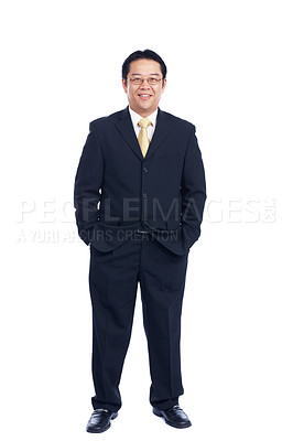 Buy stock photo Respectable Asian businessman stands confidently with his hands in his pocket