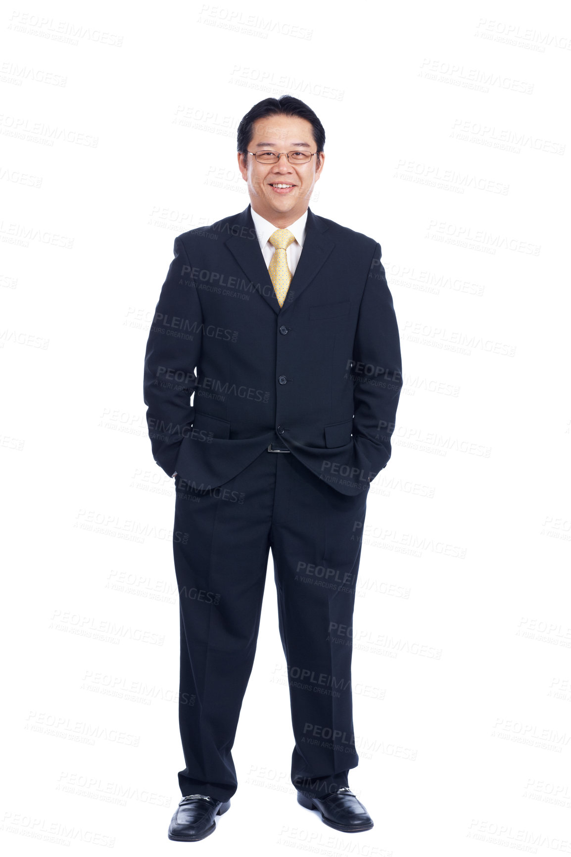 Buy stock photo Respectable Asian businessman stands confidently with his hands in his pocket