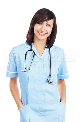 Buy stock photo Attractive nurse stands with her hands in her pockets as she smiles at you