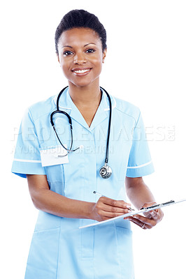 Buy stock photo Attractive female nurse writes on her medical chart - Isolated on white