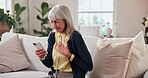 Stress, old woman and chest pain in home with phone, research and symptoms for heart attack. Discomfort, senior person and mobile app for cardiac emergency, urgent assistance and medical condition
