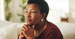 Thinking, serious or black woman in home with nostalgia, wondering mindset or contemplating on past memory. Perspective, thoughts or mature person with flashback, questioning or reflection in house.