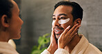 Couple, skincare and eye patch in bathroom for morning routine, dermatology and reduce dark circles. People, romantic relationship and collagen mask in house for clear skin, cosmetics and grooming.