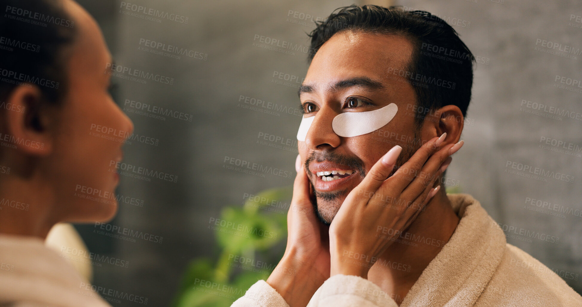 Buy stock photo Couple, skincare and eye patch in bathroom for morning routine, dermatology and reduce dark circles. People, romantic relationship and collagen mask in house for clear skin, cosmetics and grooming.