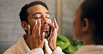 Couple, skincare and apply moisturizer in bathroom with morning routine, love or hydration benefits. People, romantic relationship and face cream in home for clear skin, cosmetics or bonding together