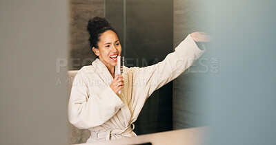 Buy stock photo Mirror, woman and singing in bathroom with hair brush, morning routine and good mood for wellness. Space, happy person and karaoke in home with cosmetic tool, reflection and grooming for self care.