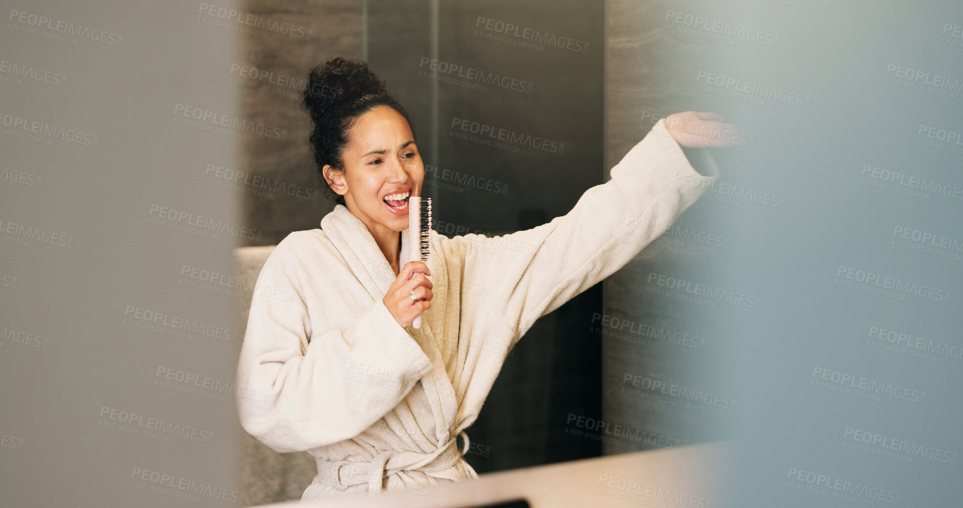 Buy stock photo Mirror, woman and singing in bathroom with hair brush, morning routine and good mood for wellness. Space, happy person and karaoke in home with cosmetic tool, reflection and grooming for self care.