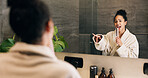 Woman, singing and hairbrush in house with bathroom mirror, morning routine or good mood for wellness. Female person, point or karaoke in home with cosmetic tool, reflection or grooming for self care