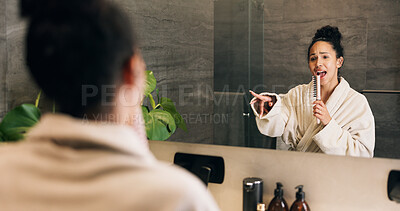 Buy stock photo Woman, singing and hairbrush in house with bathroom mirror, morning routine or good mood for wellness. Female person, point or karaoke in home with cosmetic tool, reflection or grooming for self care