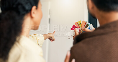 Buy stock photo Pointing, palette and couple in home for renovation, diy project and talking for painting. Marriage, back and man with woman with choice, planning and color for interior design, decor and remodeling