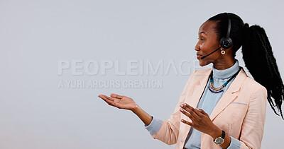 Buy stock photo Headset, consultant and black woman with space in studio for call center advice on a white background. Happy person, agent or advertising tips with mockup for virtual assistance or customer service