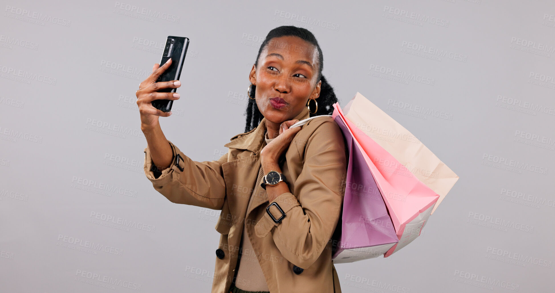 Buy stock photo Happy, selfie and black woman with shopping bags in studio for photography on a white background. Female person, user or shopper with picture, gifts or presents for memory, store discount or deal