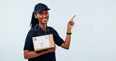 Buy stock photo Pointing, portrait and happy woman in studio for delivery, shipping and info for courier service. Mockup, space and African person with box for ecommerce, logistics or advertising on white background