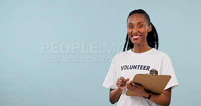 Buy stock photo Clipboard, black woman and portrait of volunteer in studio by space for marketing of ngo service. Happy, activist and charity worker on blue background with advertising, options or donation guide.