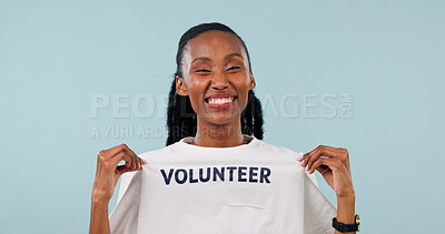 Buy stock photo Volunteer, portrait and black woman with tshirt, smile and pride for charity work in studio. Non profit, happy and space for motivation, nonprofit and social responsibility on blue background