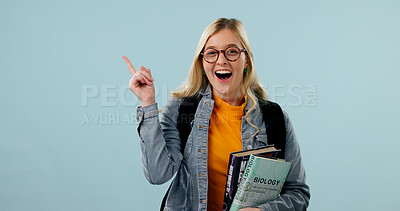 Buy stock photo College student, education and woman point in studio, science knowledge and space with shock. Learning, books and excited person with mockup promo, biology scholarship or portrait on blue background