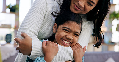 Buy stock photo Safety, child and hug with mother for love, connection and security with smile in home. Portrait, happy daughter and mom with embrace for bonding together, family support and kid with single parent