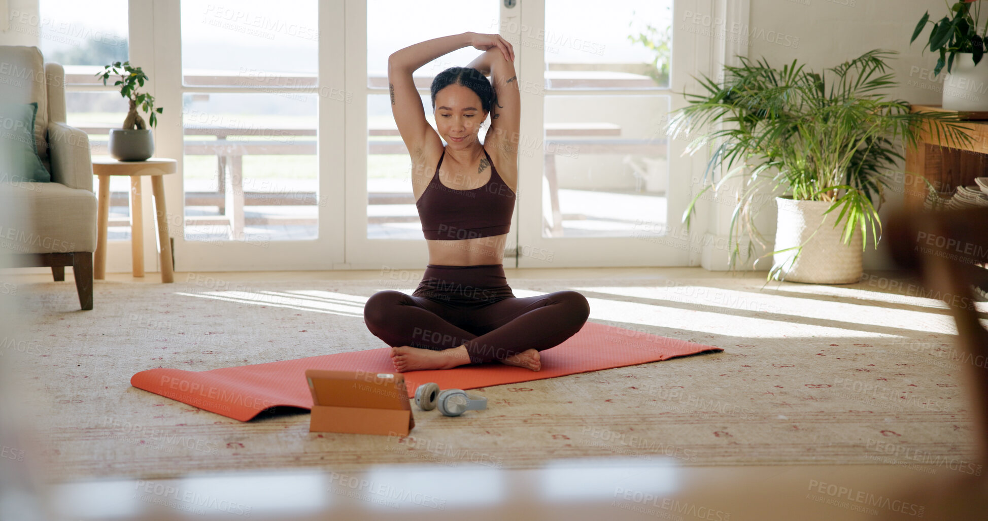 Buy stock photo Yoga, woman and stretching with tablet in house for wellness tutorial, fitness guide or benefits. Tech, warm up and happy person on floor at home for pilates, health or exercise in online class