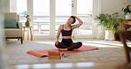 Yoga, woman and stretching with tablet in home for wellness tutorial, fitness and pain relief. Tech, neck exercise and person on floor for pilates, health benefits and self care in online class