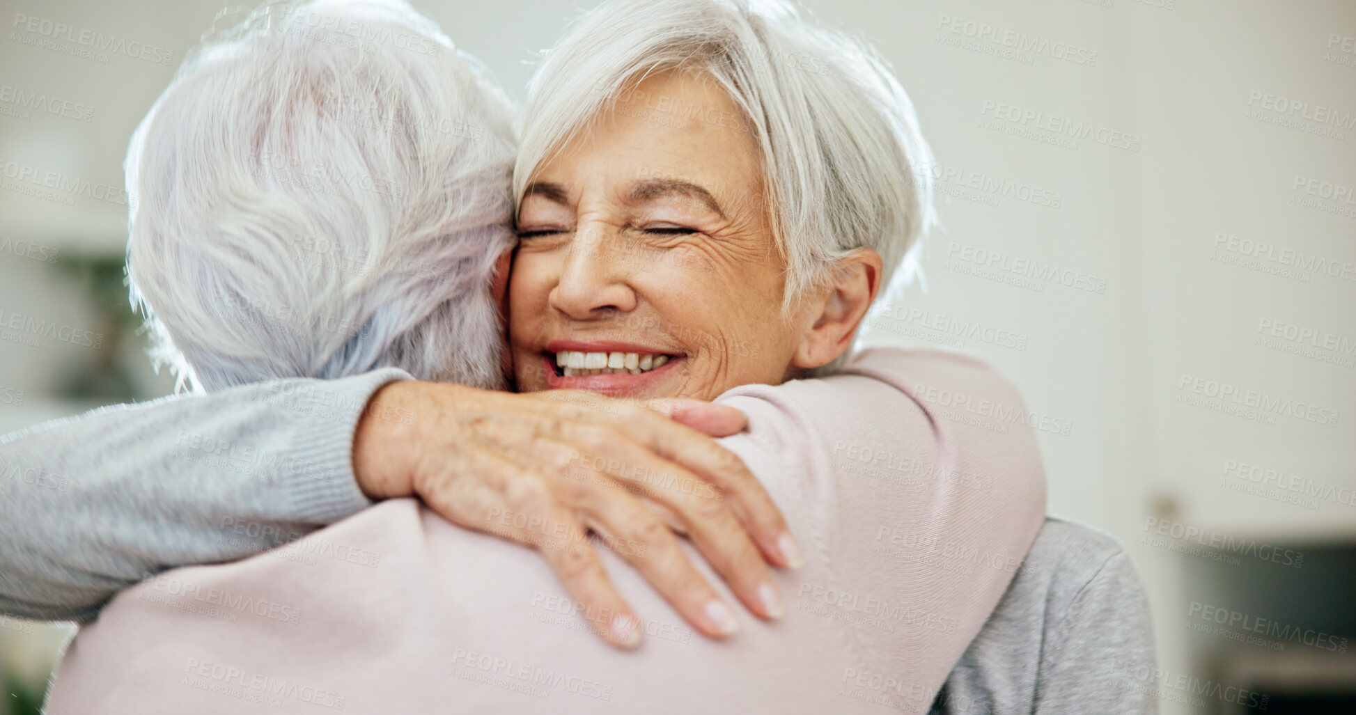 Buy stock photo Hug, friends and senior women in home for bonding, affection and connection for reunion. Happy, retirement and elderly people with embrace, love and care for relationship, support and compassion