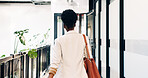 Back, job opportunity and walk with business woman for arrival, morning commute and career path. Company, start and black person at door, punctual or new beginning for professional development