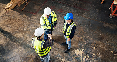 Buy stock photo Above, engineer and handshake at construction site for development deal, agreement or cooperation. Team, architect and shaking hands with people for collaboration, safety approval and top view