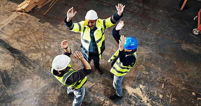 Buy stock photo Above, men and construction workers with celebration on site for building, repairs or renovation. Cheering, teamwork and civil engineers with collaboration on maintenance or property development.