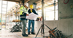 Blueprint, collaboration and construction workers on site for discussion on repairs, renovation or building. Men, floor plan and civil engineer with contractor for property development or maintenance