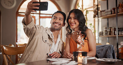 Buy stock photo Couple, selfie and bonding on date in restaurant, connection and profile picture with partner on web. Relationship, celebration and happy people in diner for anniversary, memory or photography on app