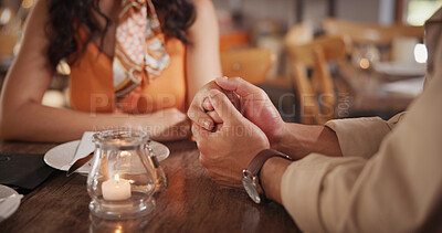 Buy stock photo Couple, holding hands and commitment on date in restaurant, love or connection with partner on break. Relationship, trust and people in diner for anniversary, support and bonding together on weekend