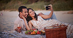Love, selfie or couple at beach with picnic, memory capture or social media post on anniversary. Digital, happy or people with fruit basket, partner connection or honeymoon photo on outdoor date.