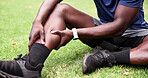Park, man and calf pain with hands, fitness and grass field for exercise and workout with muscle tension. Person, athlete and runner with outdoor accident, overworked joint and burnout from training