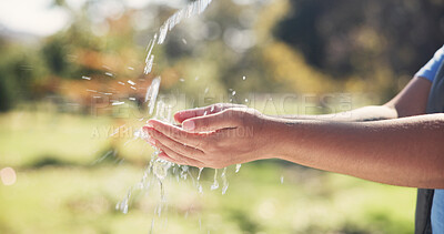 Buy stock photo Safety, water and person washing hands outdoor for hygiene, sanitation and grooming with self care. Wellness, health and cleaning skin in park for removal of dirt, germs or bacteria in countryside.