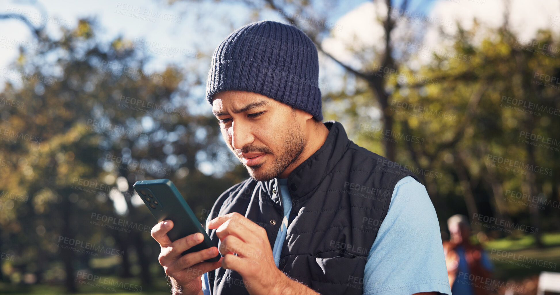 Buy stock photo Confused, man and volunteer at park with phone, wrong location and distribution error for charity. Unsure, male person and mobile in nature for outreach, incorrect donation and website glitch for ngo