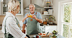 Cooking, cheers and mature couple with juice in kitchen for help, bonding and meal prep together. Marriage, happy and man with woman with drinks to prepare dinner, supper and lunch for relationship