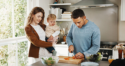 Buy stock photo Parents, baby and happy with cooking in kitchen of home for bonding, teaching and support. People, family and smile or excited for preparing dinner with ingredients or vegetable for child development