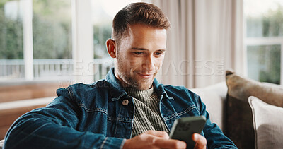 Buy stock photo Phone, happy and man on sofa in home with texting, chatting or social media on mobile app. Smile, relax and person on cellphone for reading online blog for tips or advice in living room at apartment.