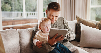 Buy stock photo Father, boy and smile with tablet on sofa for elearning video, bonding and relax in living room. Man, dad and child with tech, movies and streaming subscription with funny cartoon in family house