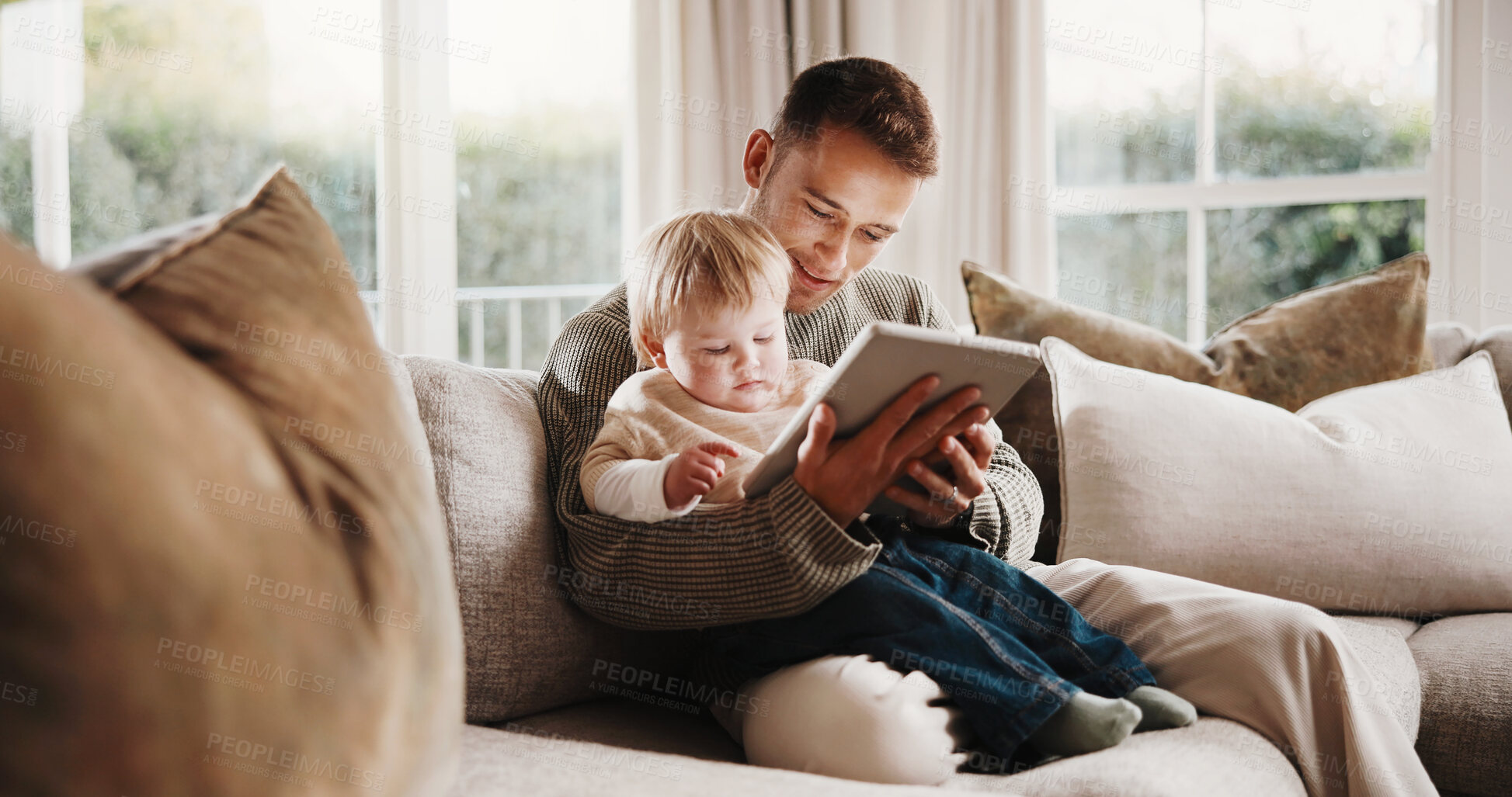 Buy stock photo Father, boy and relax with tablet on couch for elearning video, bonding and smile in living room. Man, dad and child with tech, movies and streaming subscription with funny cartoon in family house