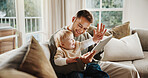 Dad, baby and high five with tablet on sofa for elearning video, bonding or smile in living room. Man, father and child with tech, movies and streaming subscription with funny cartoon in family house