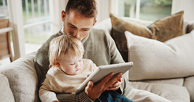 Buy stock photo Dad, baby and kiss with tablet on sofa for elearning video, bonding or love in living room. Man, father and child with tech, movies and streaming subscription with funny cartoon in family house