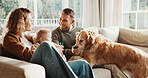 Parents, baby and dog with love on couch for care, play and smile for bonding or connection in home. Father, mother and child in living room for pet animal, stroke and relax on sofa at family house