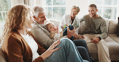 Buy stock photo Happy, family and grandparents with child on sofa for bonding, playing and connection for visit. Home, generations and mom, dad and senior parents with baby for love, care and relationship on weekend