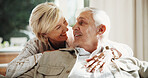Hug, smile and couple on sofa in home for bonding, love and connection in marriage on weekend. Happy, care and mature woman embracing man in living room for commitment, relax or safety in apartment.
