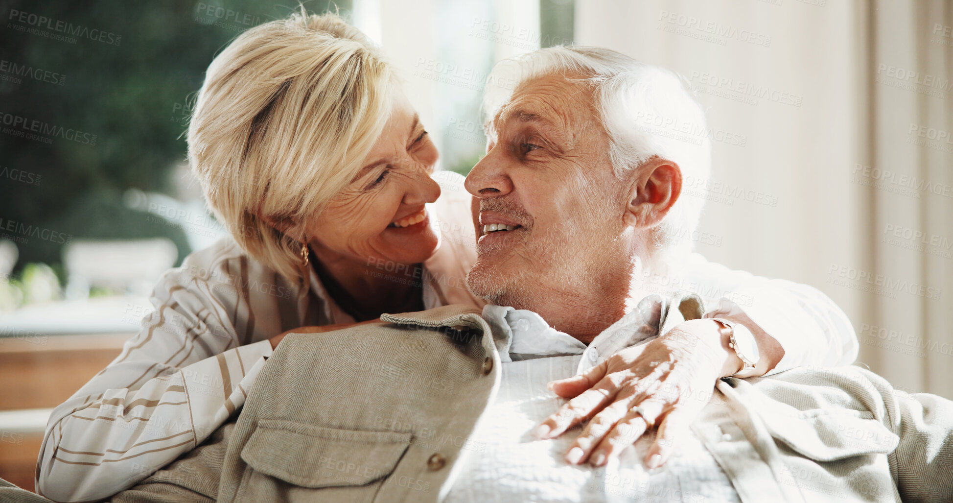 Buy stock photo Hug, smile and couple on sofa in home for bonding, love and connection in marriage on weekend. Happy, care and mature woman embracing man in living room for commitment, relax or safety in apartment.