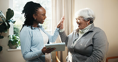 Buy stock photo High five, old woman and physiotherapist with tablet in home for goals or motivation with feedback. App, celebration and chiropractor with senior patient in apartment, recovery results or success